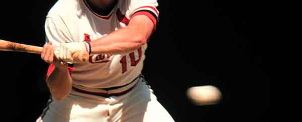 Baseball Player at Bat with Ball